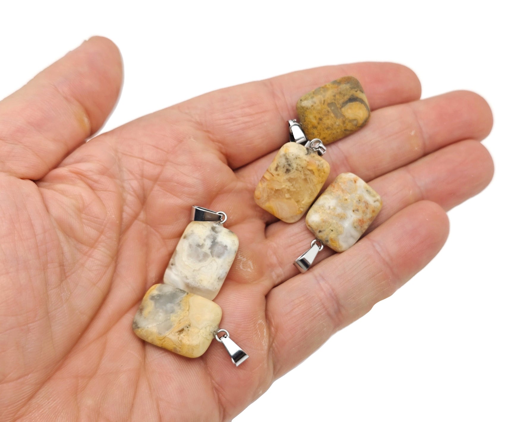 Rectangle-shaped Crazy Lace Agate crystal pendant from GemstoneGO, showcasing vibrant banded patterns and polished gemstone craftsmanship.