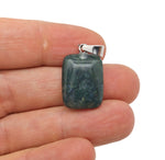 Moss agate rectangle crystal pendant from GemstoneGO, showing polished gemstone with natural green and brown moss patterns.
