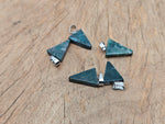 Moss agate triangle-shaped crystal pendant from GemstoneGO, showcasing natural green and brown banding, photographed on a plain background.