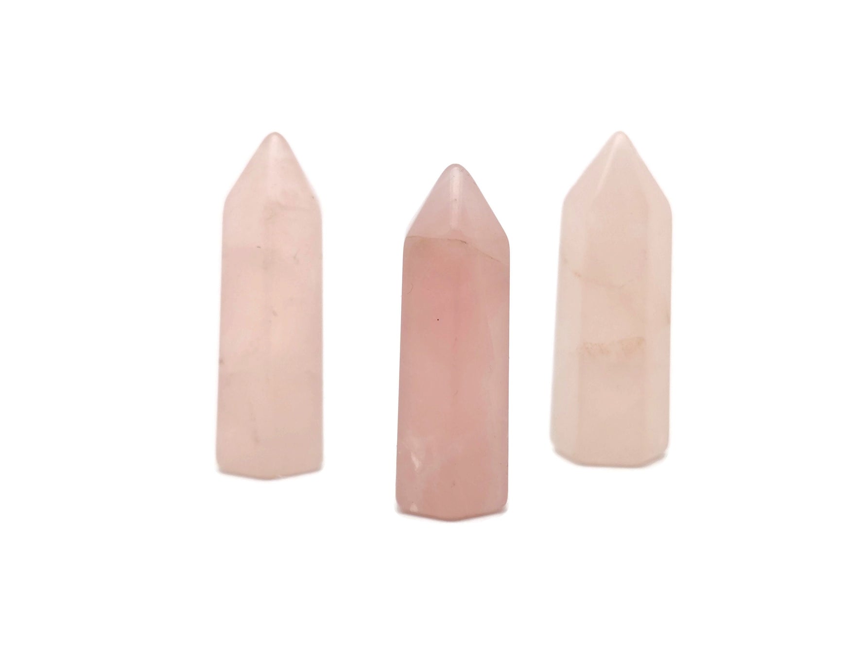Rose Quartz obelisk tower crystal, 40mm gemstone with pink hue, from GemstoneGO, showcasing smooth polished surface and natural veining.
