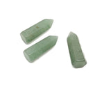 A 40mm Aventurine Obelisk Tower crystal from GemstoneGO, featuring green gemstone with natural striations and polished pointed top.