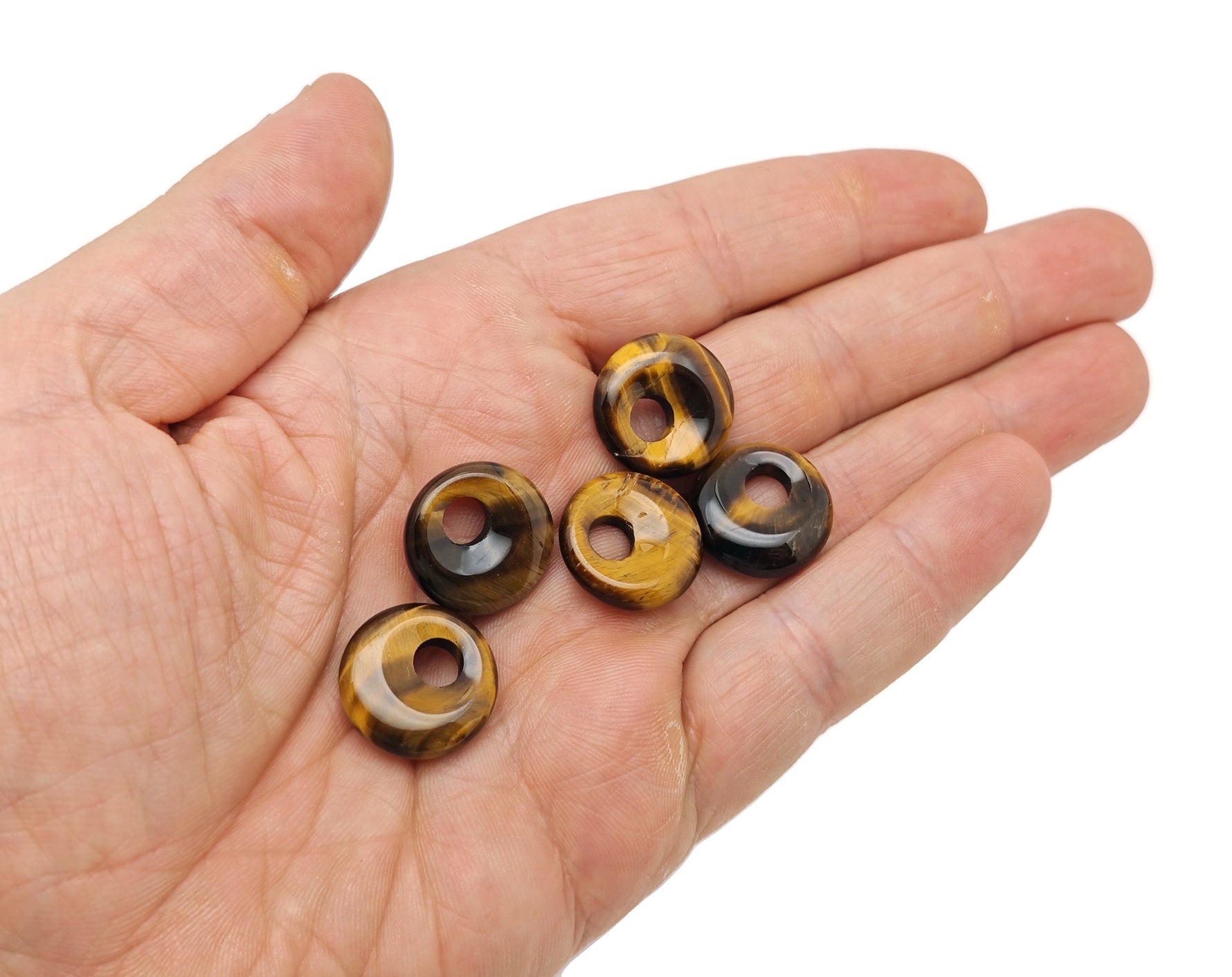 Tiger Eye Crystal Donut gemstone from GemstoneGO, 18mm Pi Stone with rich golden-brown chatoyancy and smooth, polished surface.