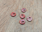 Red Jasper crystal donut pendant from GemstoneGO, 18mm Pi stone with vibrant red and natural stone details.