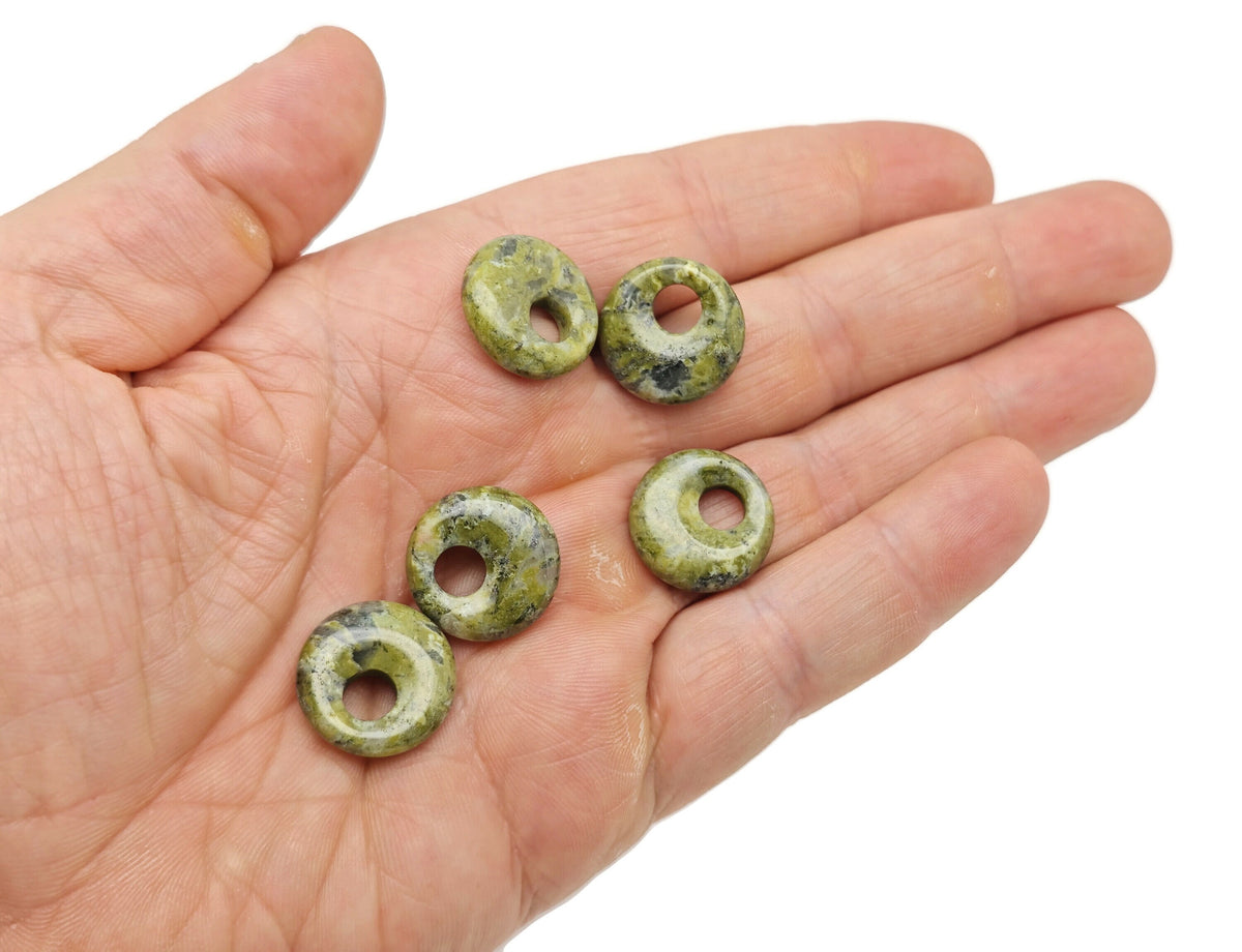 Unakite crystal donut pendant from GemstoneGO, 18mm Pi stone with natural green and pink mineral patterns.