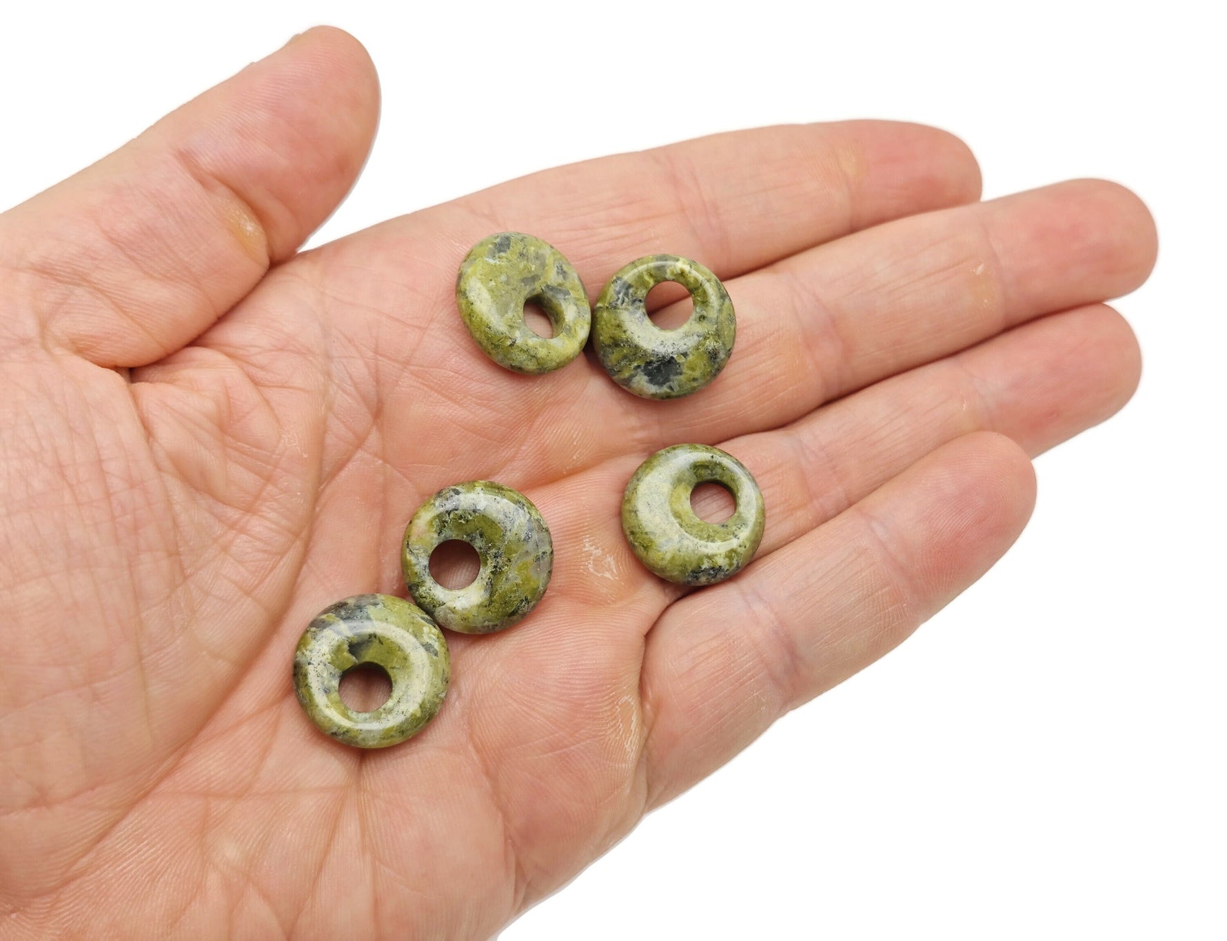 Unakite crystal donut pendant from GemstoneGO, 18mm Pi stone with natural green and pink mineral patterns.
