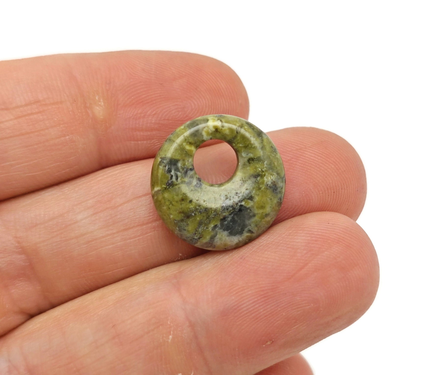 Unakite crystal donut pendant, 18mm Pi stone from GemstoneGO with vibrant green and pink hues, polished gemstone for jewelry.