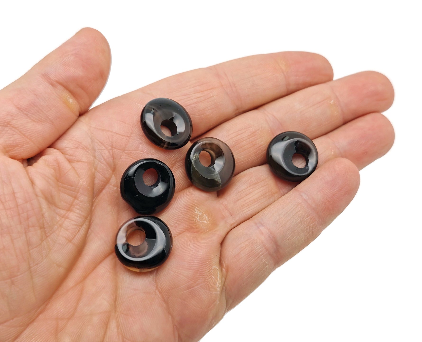 Black agate crystal donut pendant, 18mm Pi stone from GemstoneGO, featuring a smooth, polished black agate with a circular shape.