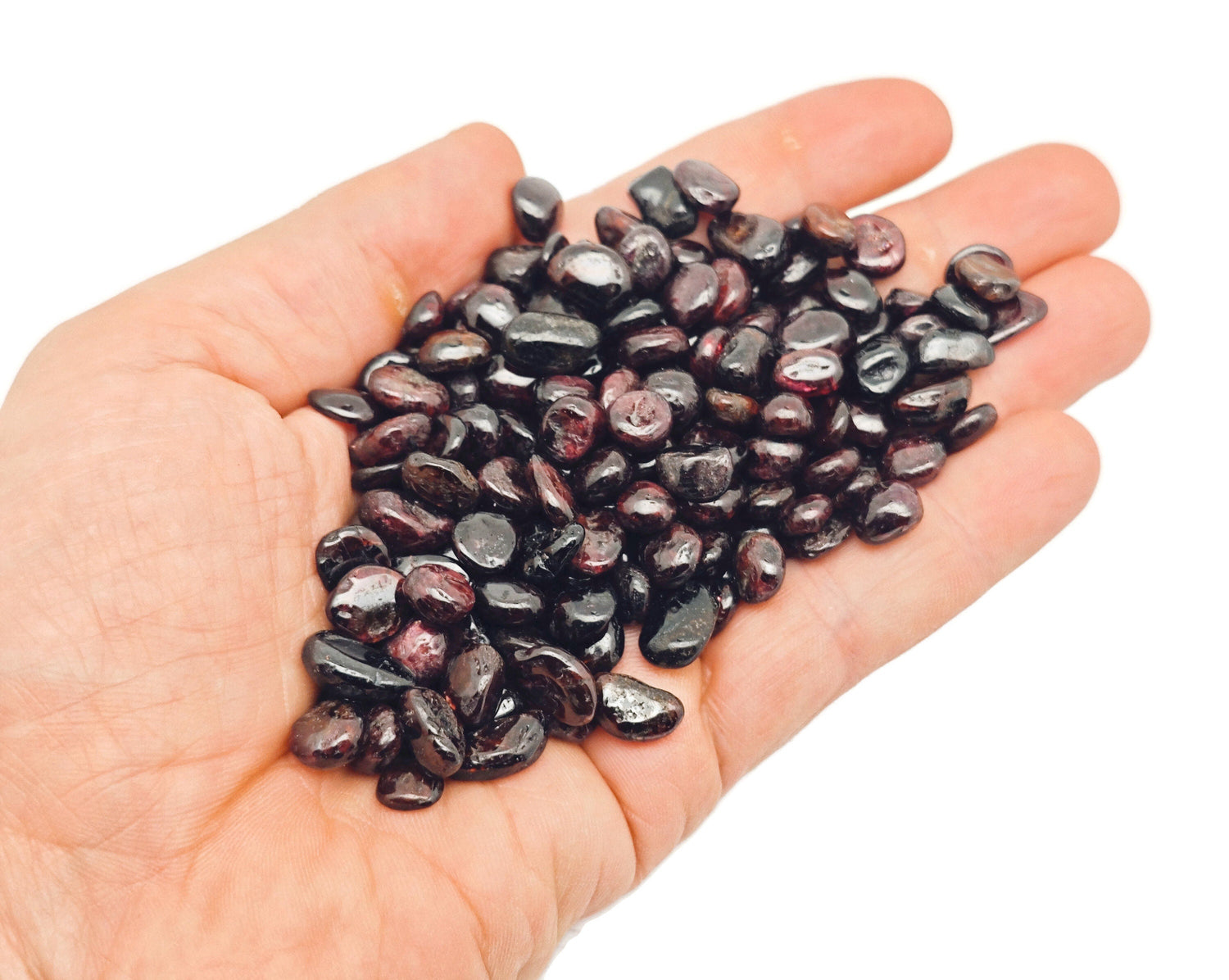 Semi-tumbled garnet crystal chips in 7-9mm size, bulk gemstone from GemstoneGO, showcasing deep red, polished stone pieces.