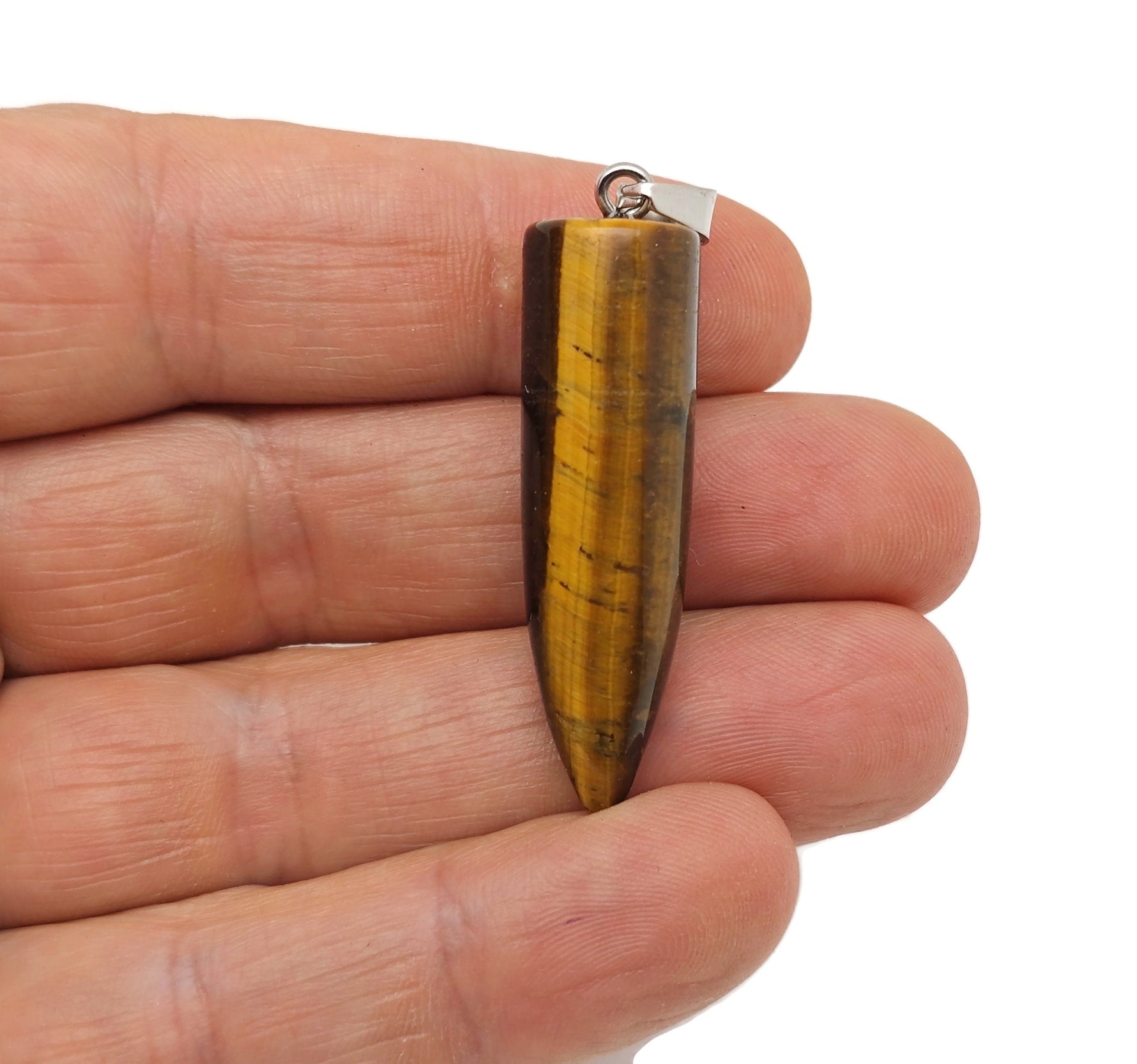 Polished tiger eye gemstone bullet pendant with carved details, showcasing smooth, shiny surface and rich, warm brown tones.