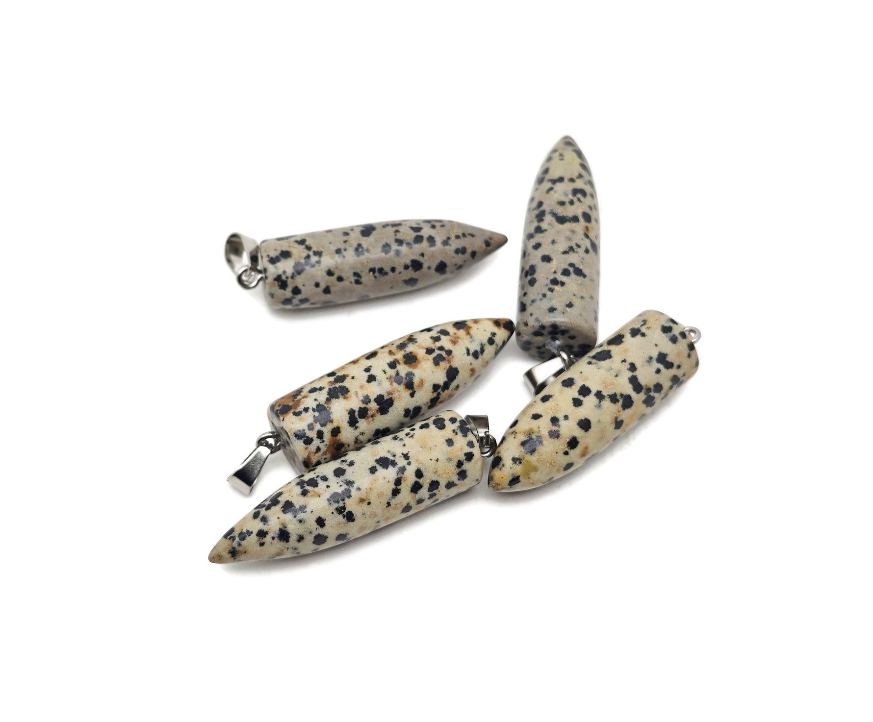Dalmatian Jasper Bullet gemstone pendant with polished carved design from GemstoneGO, featuring black spots on a cream background.