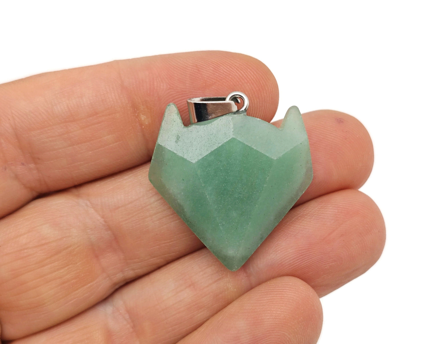 Aventurine gemstone wolf head pendant from GemstoneGO, featuring detailed crystal jewelry design.