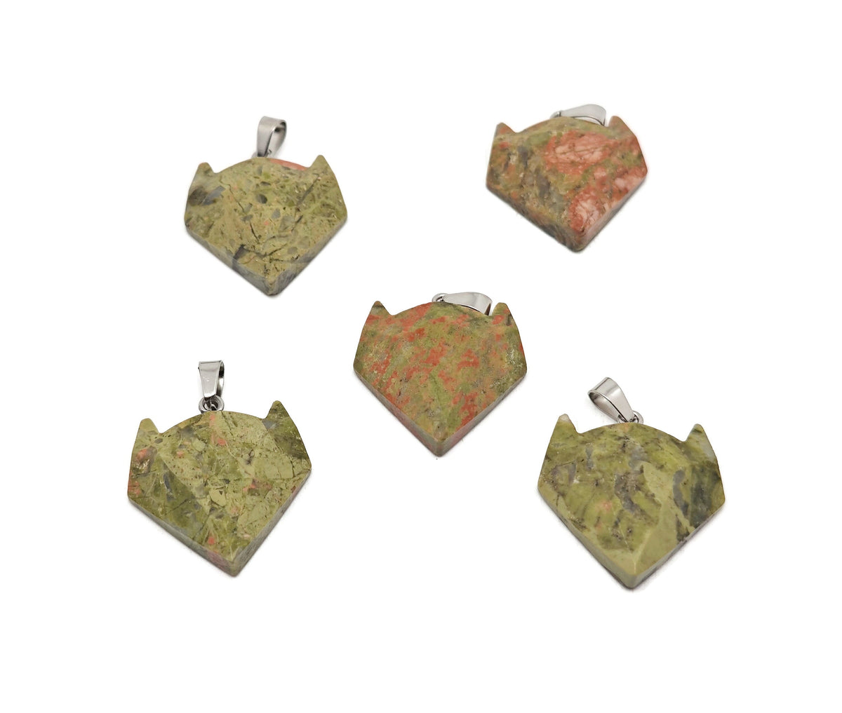 Unakite wolf head gemstone pendant from GemstoneGO featuring natural crystal jewelry with detailed wolf design.