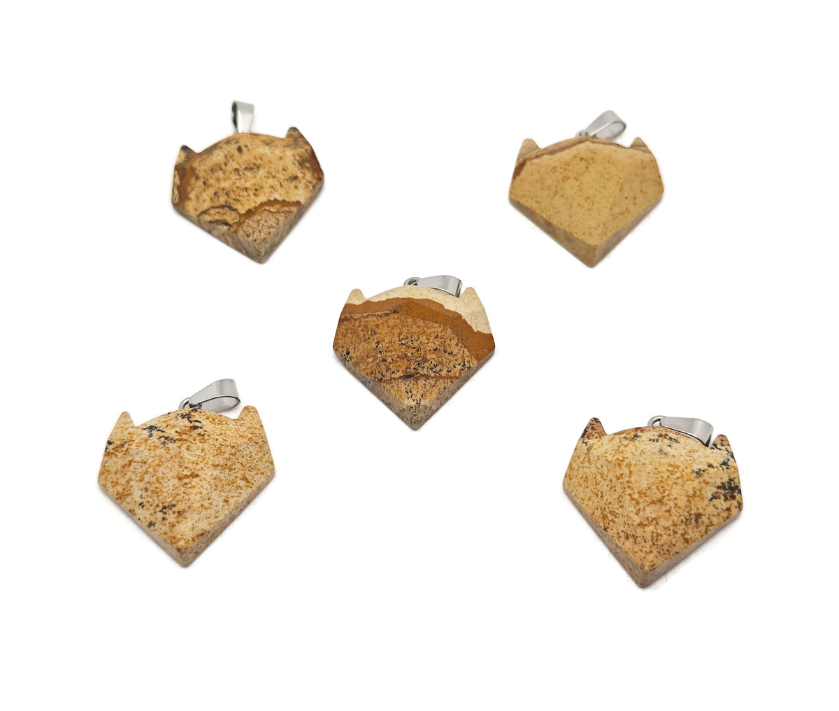 Picture Jasper wolf head pendant from GemstoneGO featuring a carved gemstone wolf's head in earthy tones for jewelry.