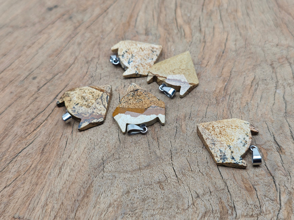 Picture Jasper wolf head gemstone pendant from GemstoneGO featuring a detailed wolf motif in earthy tones.