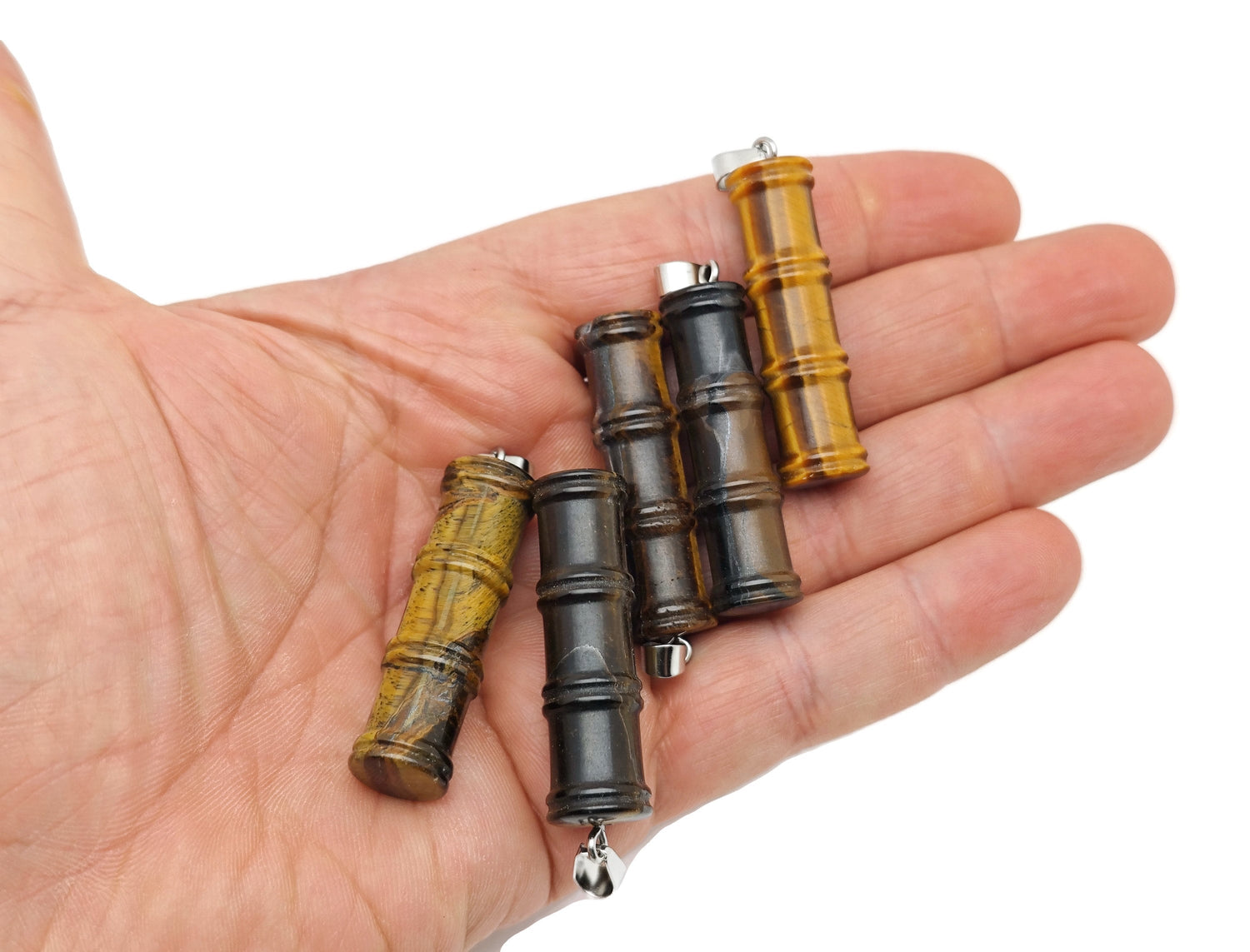 Tiger Eye bamboo-shaped crystal pendant from GemstoneGO, featuring a protective tiger eye stone on a silver bail.