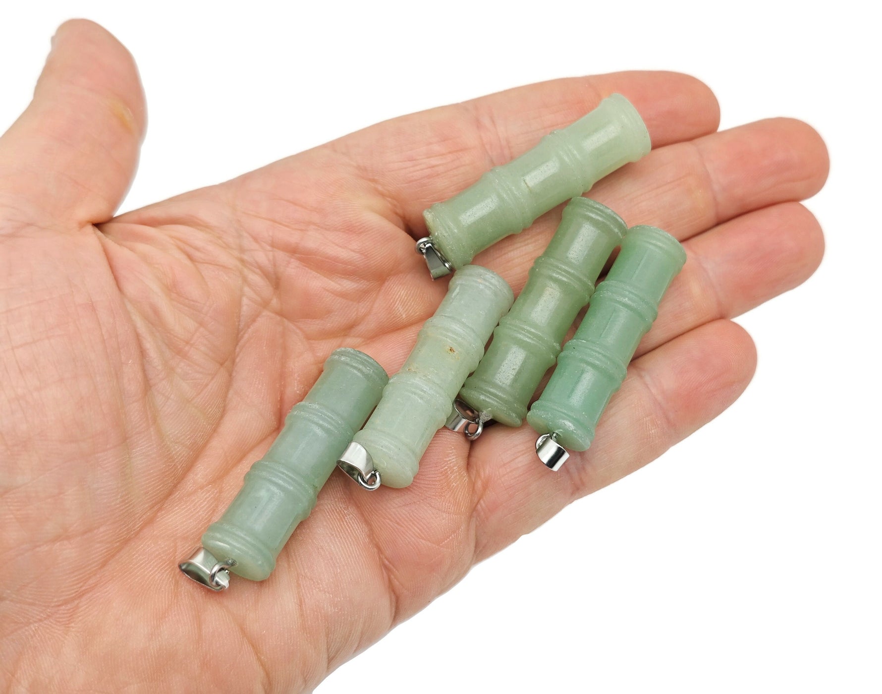 Aventurine bamboo-shaped crystal pendant from GemstoneGO featuring a protective aventurine crystal on a jewelry chain.