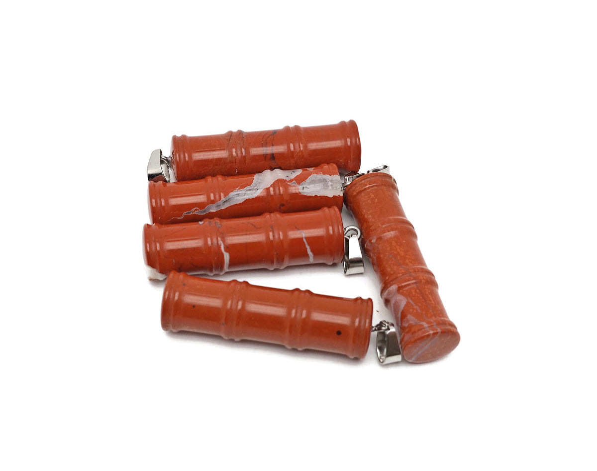 Red Jasper bamboo-shaped crystal pendant by GemstoneGO featuring a protective crystal design on a silver chain.