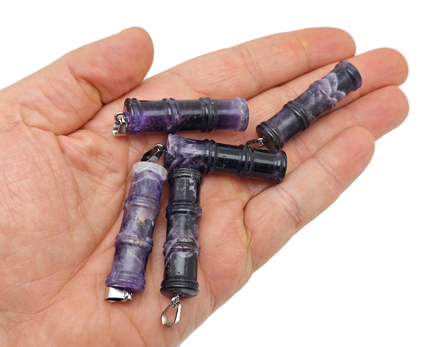 Amethyst bamboo-shaped crystal pendant from GemstoneGO featuring protective healing properties and a polished, natural stone appearance.