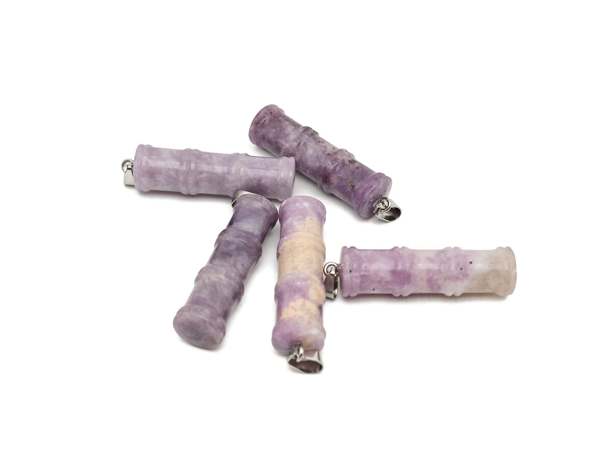 Lepidolite bamboo-shaped crystal pendant from GemstoneGO, featuring protective properties and a unique bamboo design.