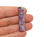 Lepidolite bamboo-shaped crystal pendant from GemstoneGO, featuring a protective healing crystal design.