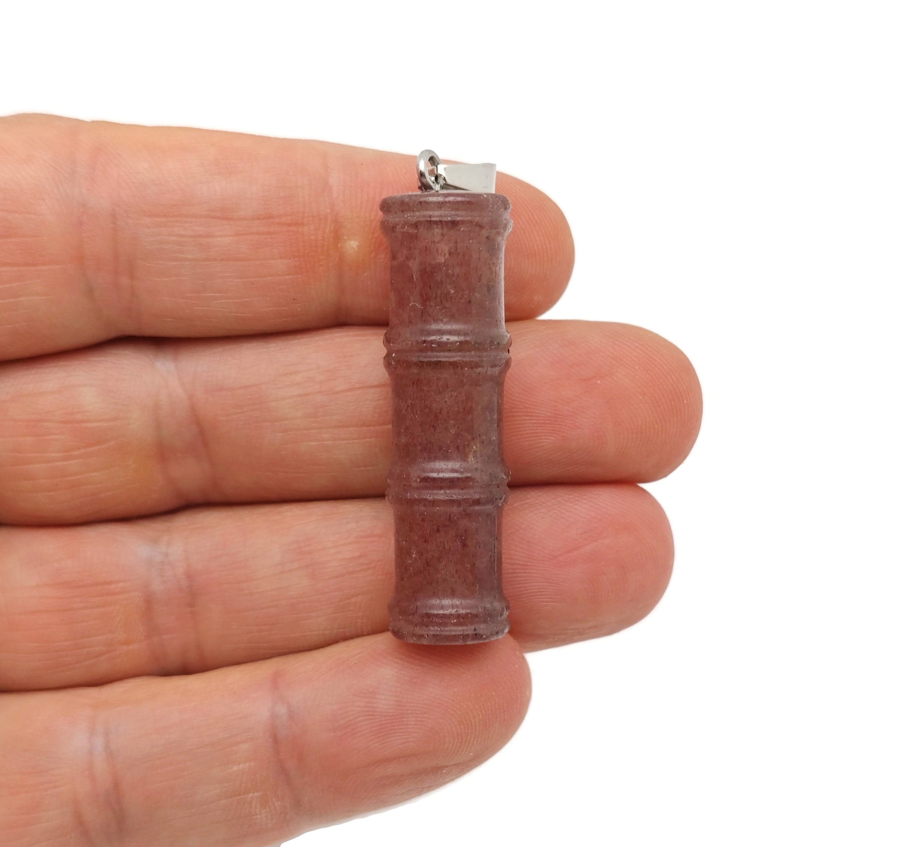 Strawberry Quartz bamboo-shaped crystal pendant from GemstoneGO, featuring a protective crystal design and vibrant pink color.