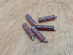 Strawberry quartz bamboo-shaped crystal pendant from GemstoneGO featuring protective healing properties and a natural gemstone design.