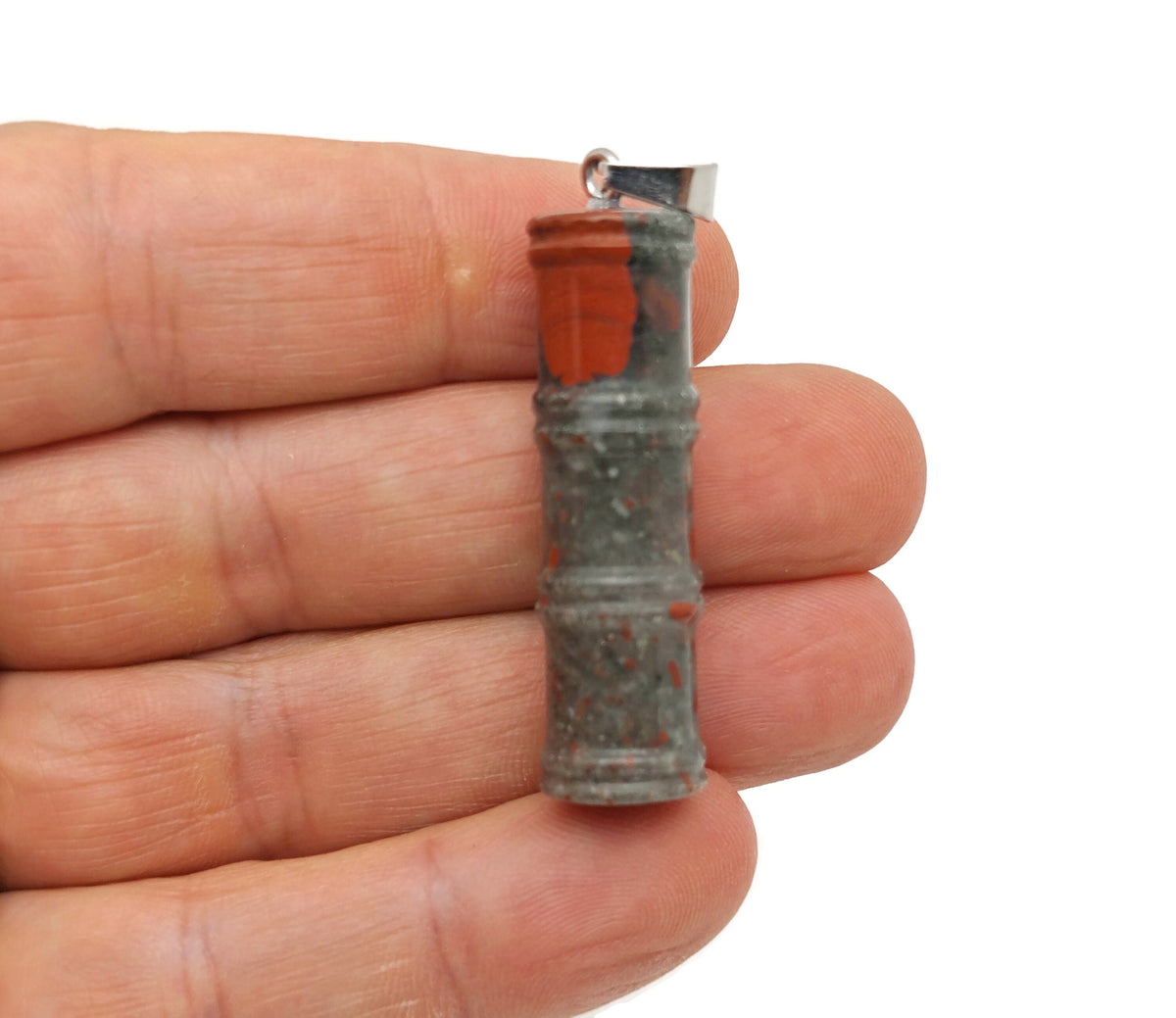 African Bloodstone bamboo-shaped crystal pendant from GemstoneGO featuring protective bloodstone gemstone in a bamboo design.