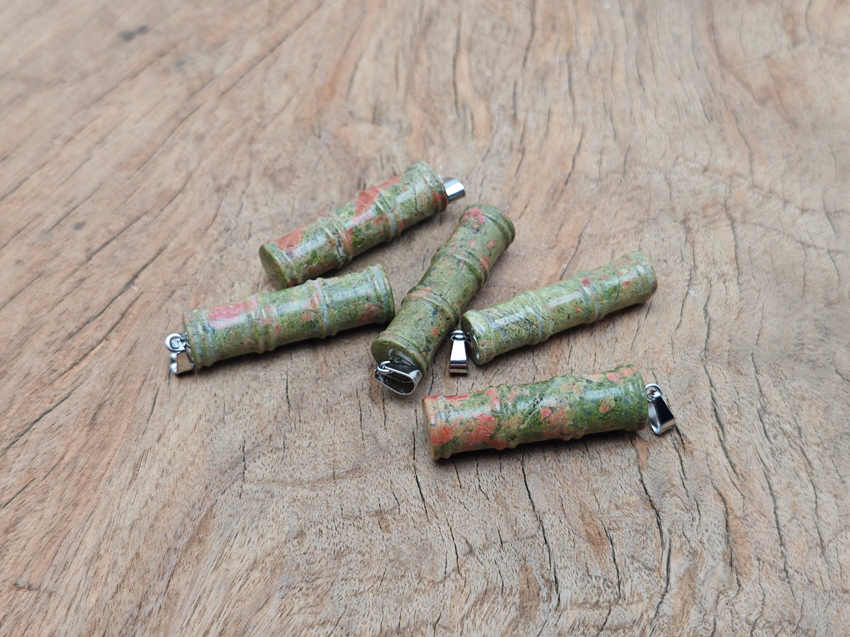 Unakite bamboo shape crystal pendant from GemstoneGO, featuring protective crystal with natural green and pink hues.