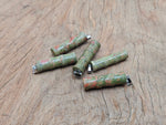 Unakite bamboo shape crystal pendant from GemstoneGO, featuring protective crystal with natural green and pink hues.