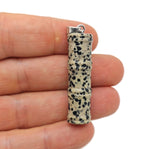 Dalmatian Jasper bamboo-shaped crystal pendant from GemstoneGO, featuring protective crystal with black and white spotted pattern.