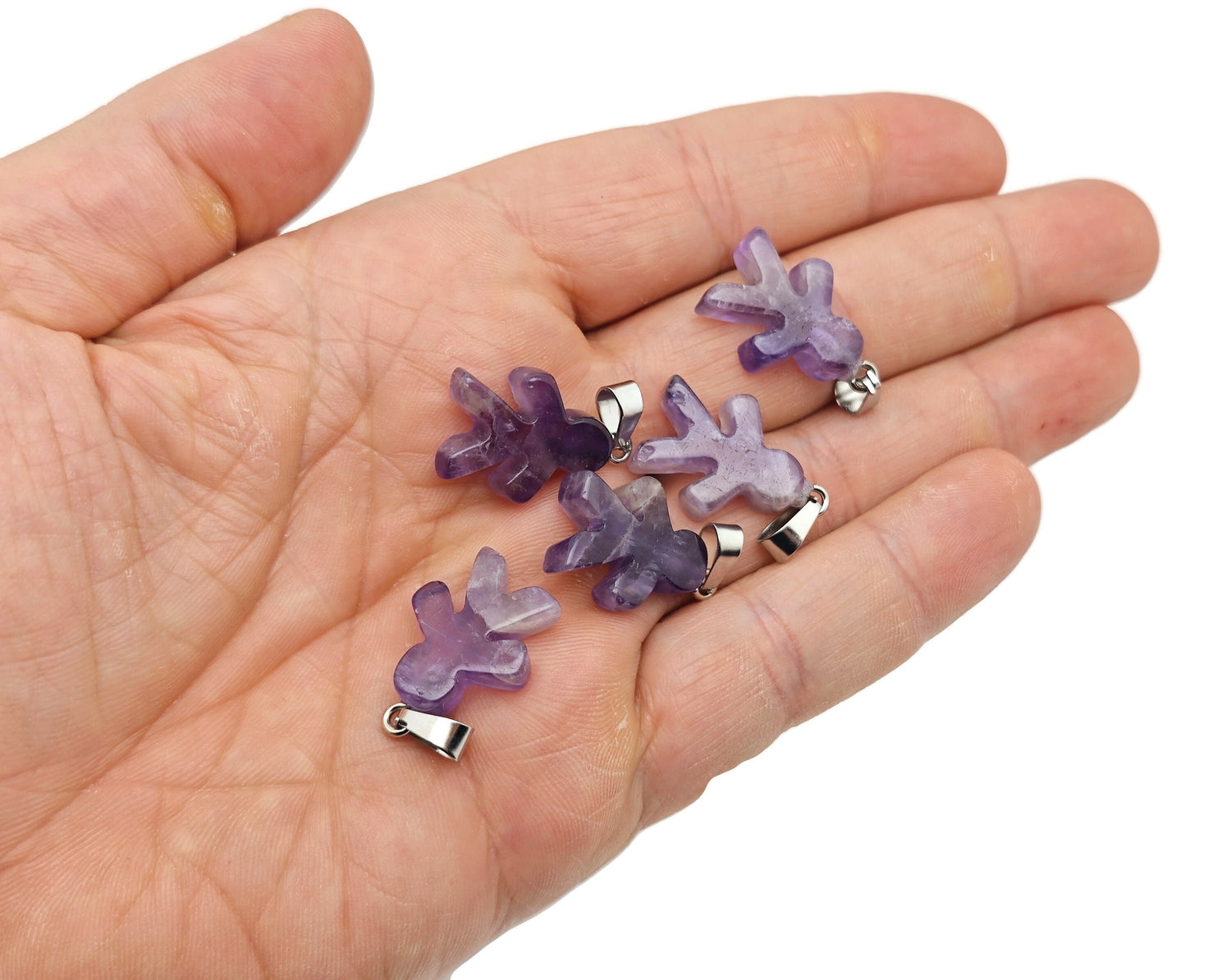 Amethyst and gingerbread-shaped crystal pendant featuring mineral specimens from GemstoneGO, displayed against a neutral background.