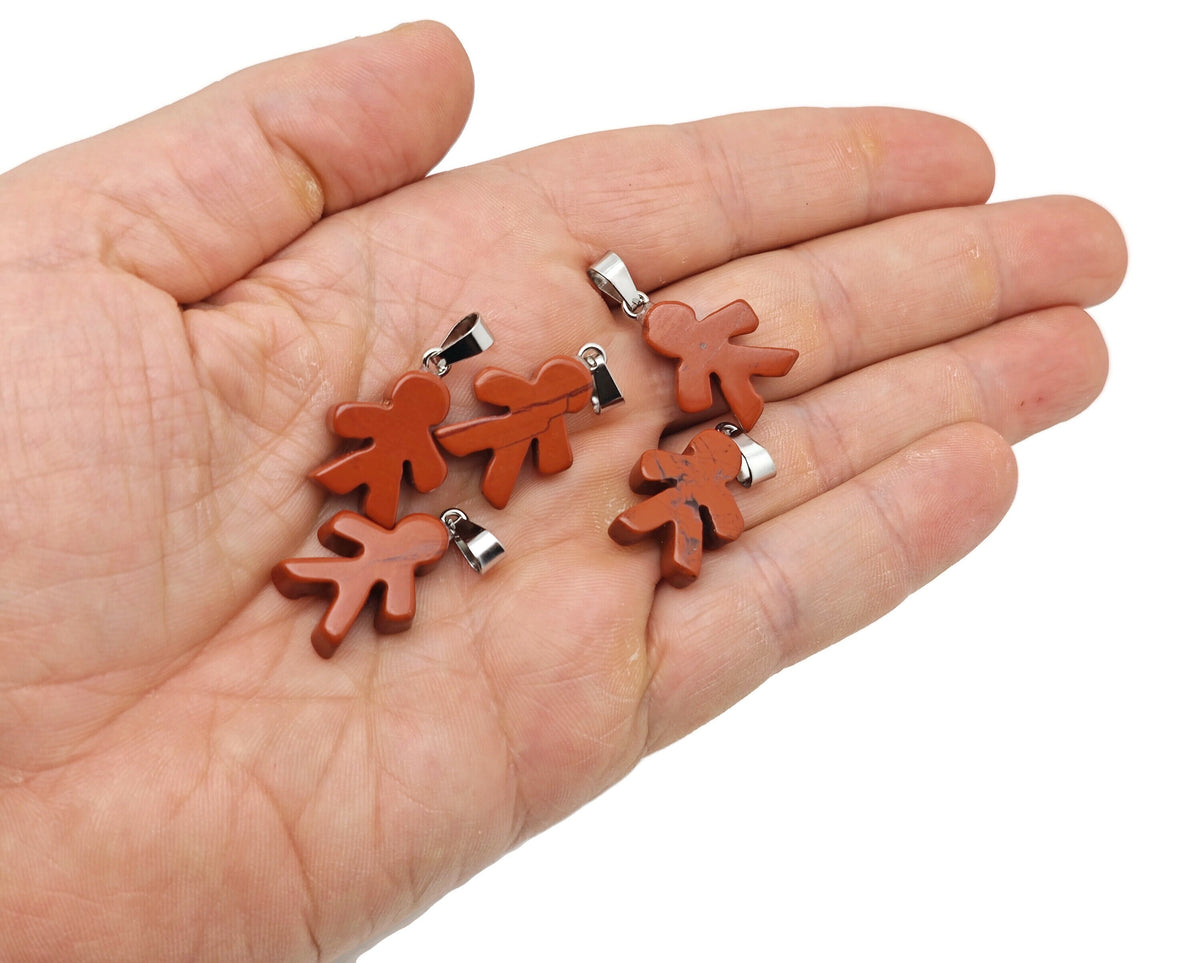 Red Jasper gingerbread cookies men crystal pendant with mineral specimen design by GemstoneGO, showcasing detailed craftsmanship.