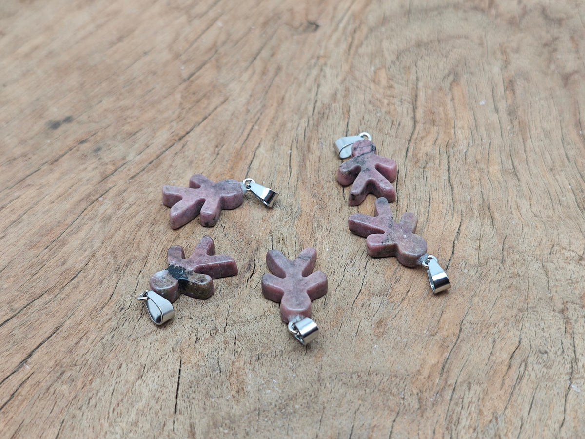Rhodonite gingerbread cookies men crystal pendant from GemstoneGO featuring mineral specimens and intricate detailing.