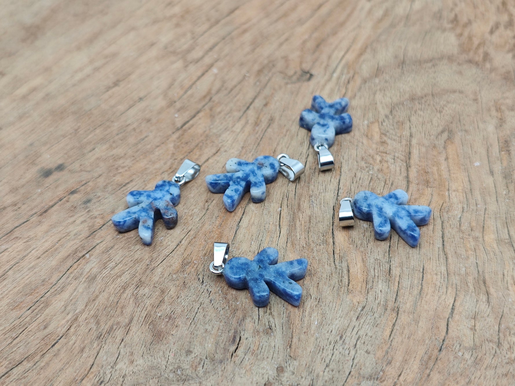 Sodalite gingerbread man crystal pendant from GemstoneGO featuring detailed mineral specimen design on a chain