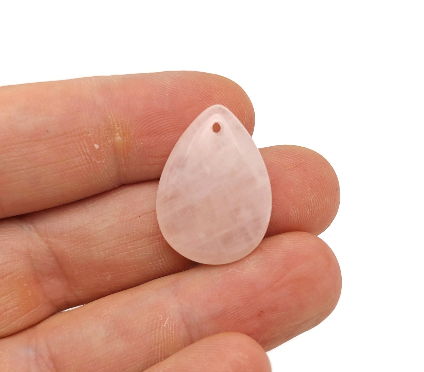Dainty rose quartz crystal pendant for jewelry making, featuring a polished drop shape, by GemstoneGO for DIY jewelry projects.
