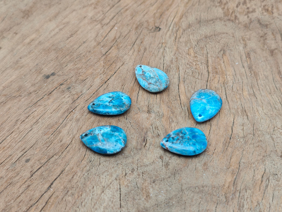 Blue apatite dainty drop crystal pendant for DIY jewelry making, featuring a delicate blue gemstone and silver-tone setting.