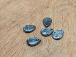 Larvikite dainty drop crystal pendant from GemstoneGO, showing a polished oval gemstone with a silver bail for DIY jewelry making.