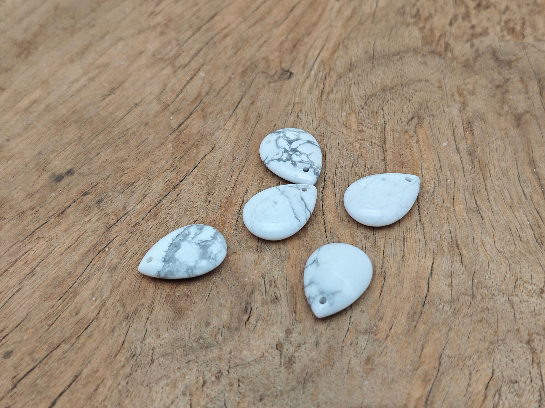 Dainty Howlite drop crystal pendant for DIY jewelry making, featuring a smooth white gemstone with subtle gray veining.