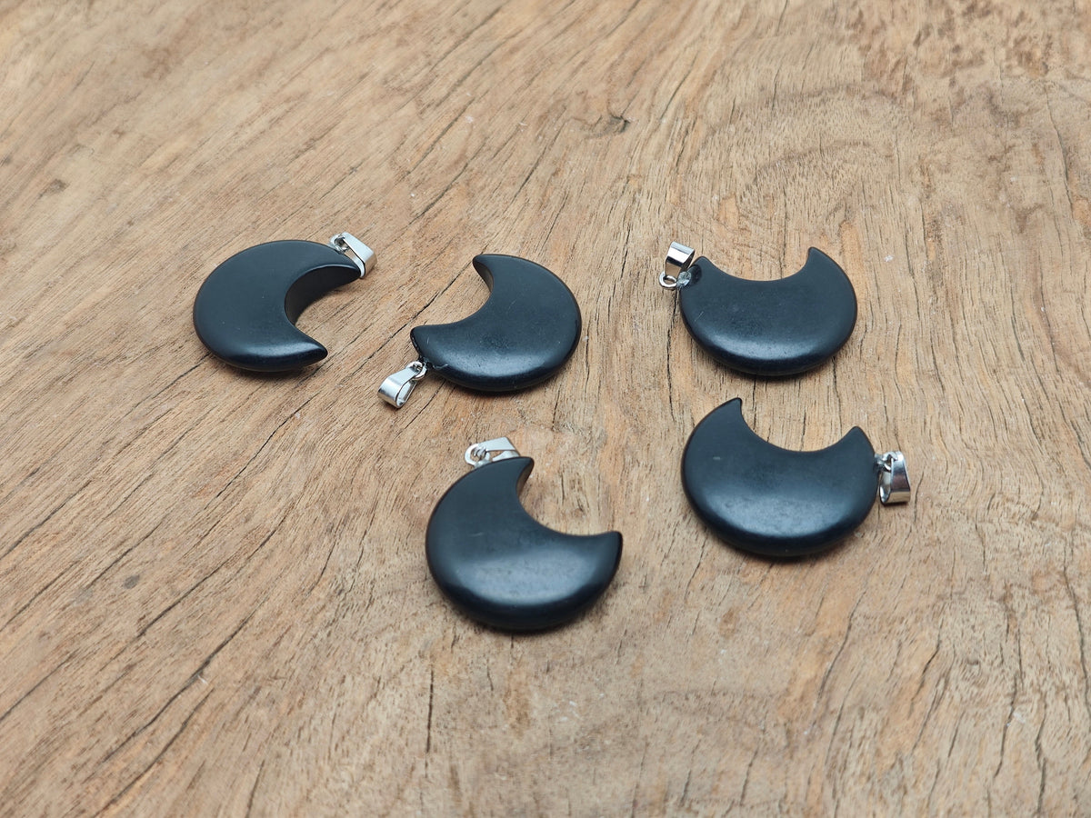 Obsidian Moon gemstone pendant featuring a crescent moon design from GemstoneGO, showcasing a polished black stone pendant.