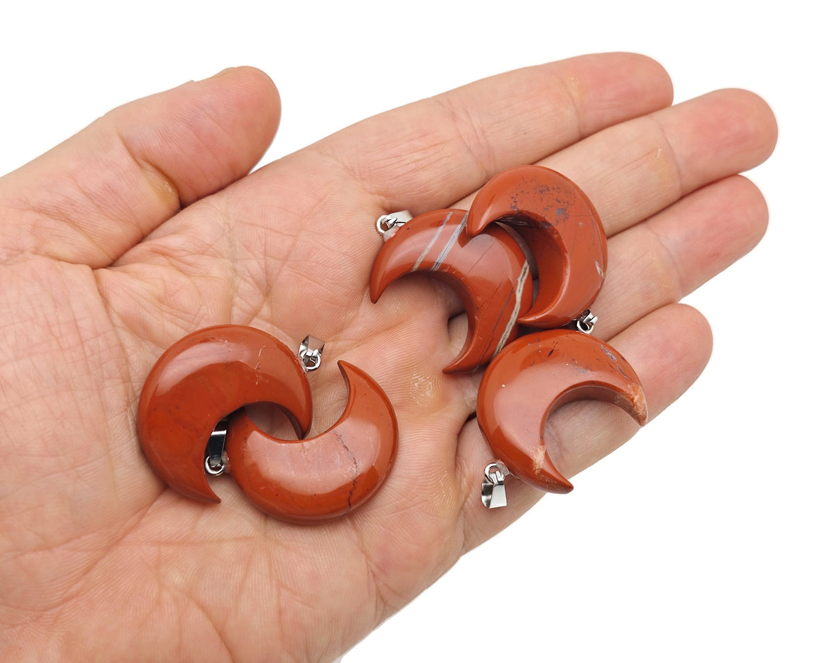 Red Jasper Moon gemstone pendant featuring a crescent moon design by GemstoneGO, showcasing vibrant red and natural stone details.