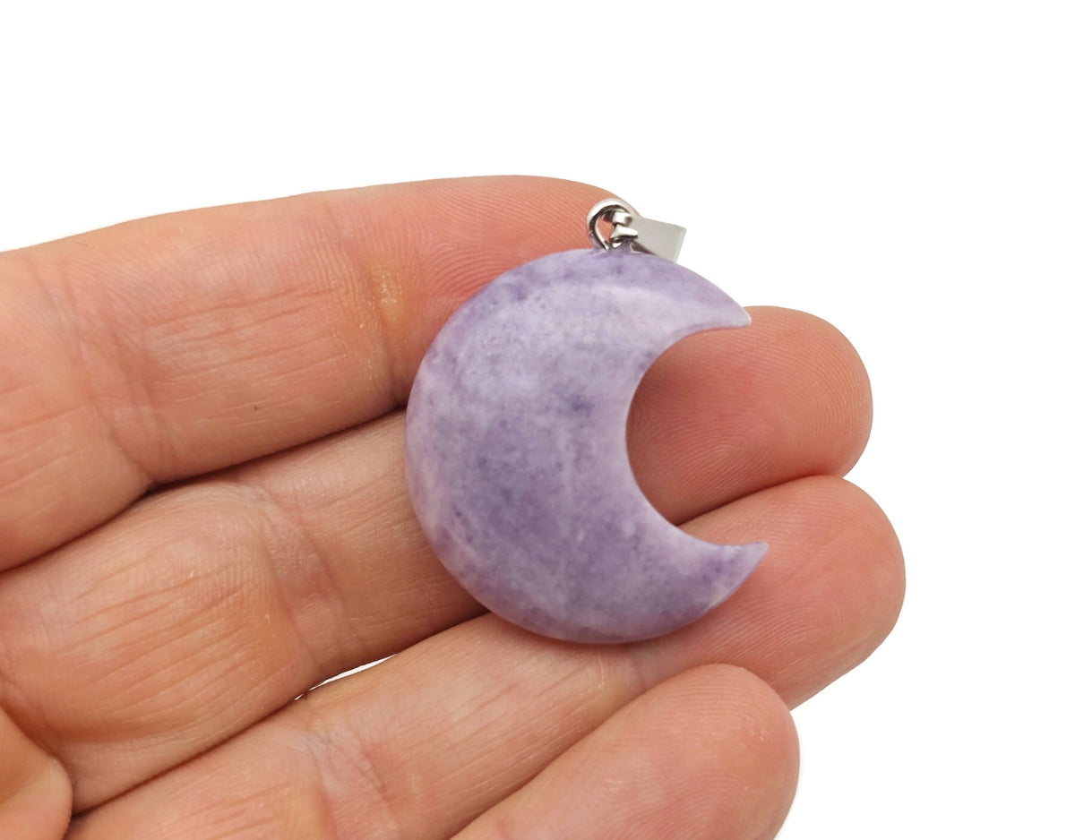Lepidolite moon pendant featuring a crescent moon shape from GemstoneGO, showcasing its purple gemstone with natural textures.