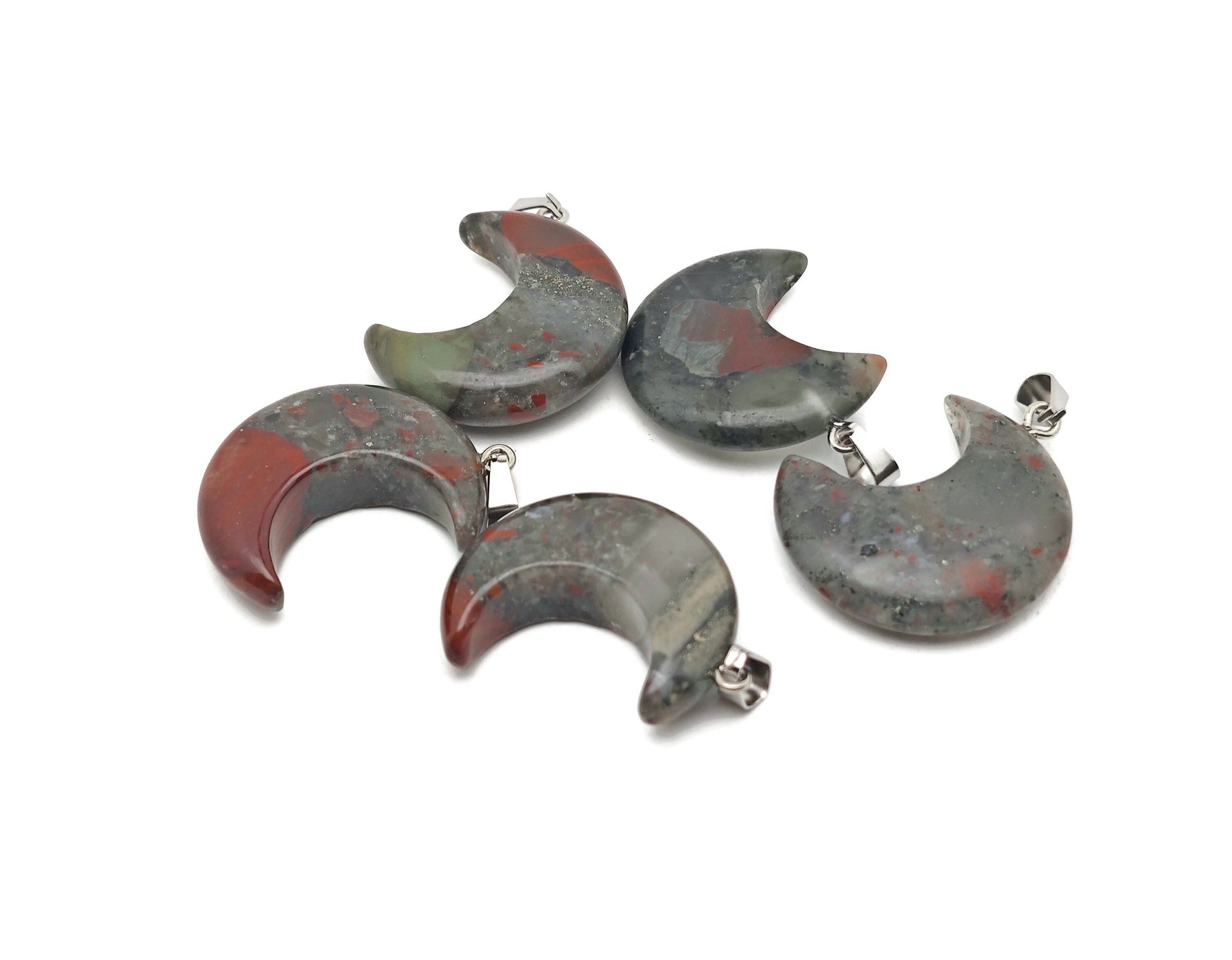 African Bloodstone moon gemstone pendant featuring a crescent moon design by GemstoneGO, showcasing deep green and red hues.