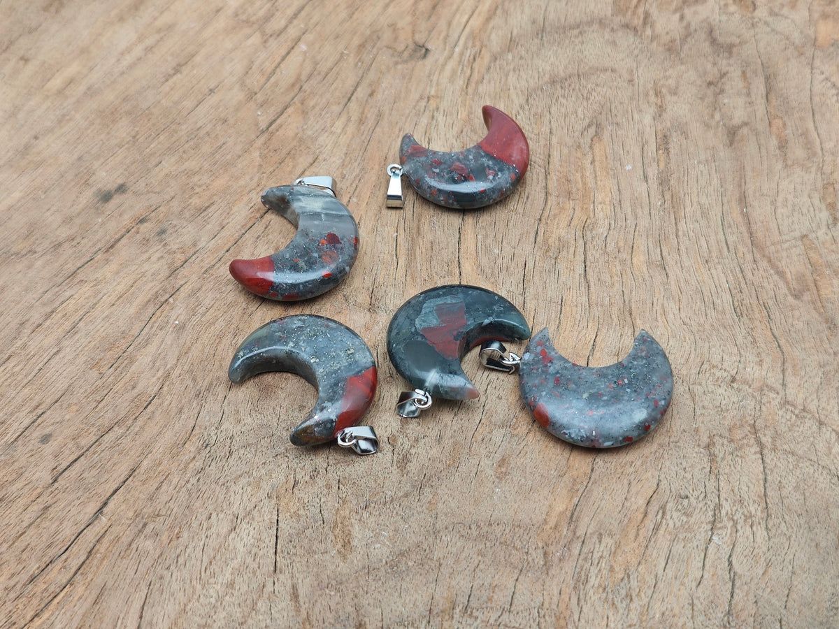 African Bloodstone moon gemstone pendant featuring a crescent moon design from GemstoneGO, showcasing deep green and red accents.