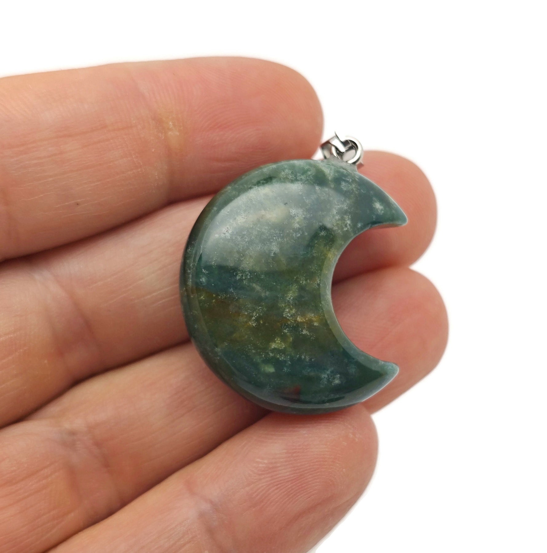 Moss Agate moon gemstone pendant featuring a crescent moon design, crafted by GemstoneGO.