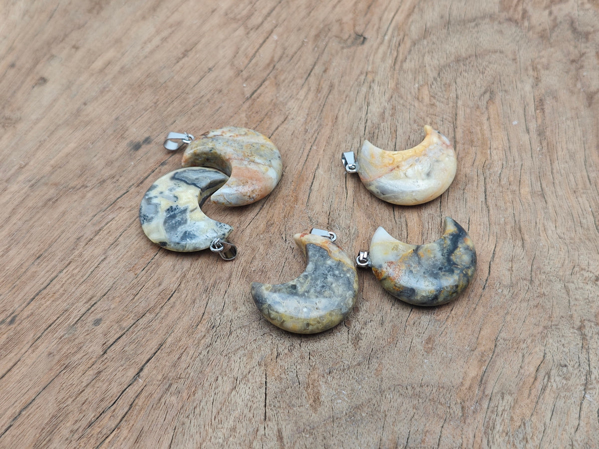Crazy Lace Agate moon gemstone pendant with crescent moon shape, handcrafted by GemstoneGO.