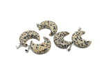Dalmatian Jasper moon pendant featuring a crescent moon shape from GemstoneGO, showcasing the distinctive black spots on a light background.