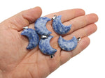 Blue Spot Jasper moon pendant featuring a crescent moon design, crafted by GemstoneGO, showcasing a vibrant gemstone with intricate details.