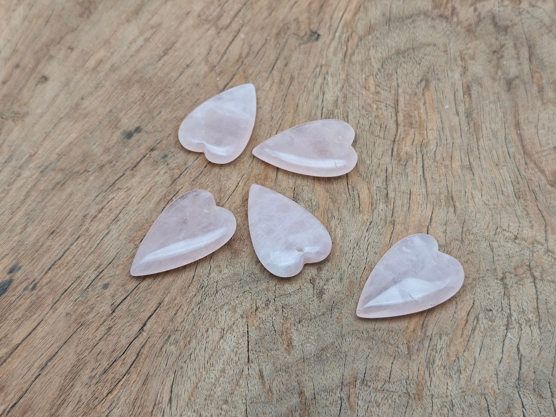 Rose quartz long heart pendant featuring a heart-shaped healing gemstone with a silver chain, crafted by GemstoneGO.