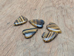 Tiger Eye long heart-shaped love crystal pendant featuring a polished gemstone with natural golden-brown hues.