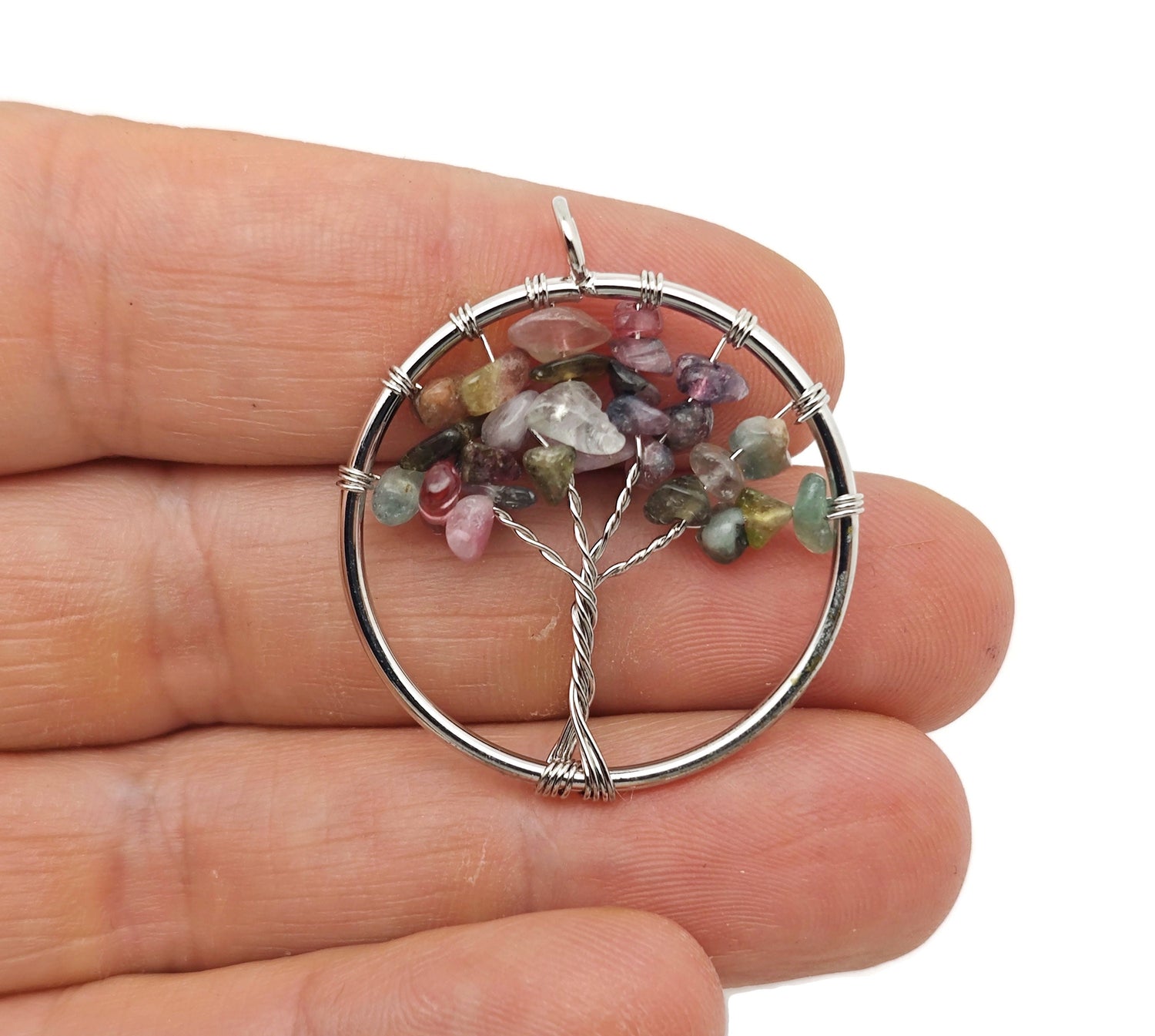 Rainbow tourmaline gemstone Tree of Life pendant with colorful crystals, showcasing intricate wire wrapping and vibrant gemstone details.